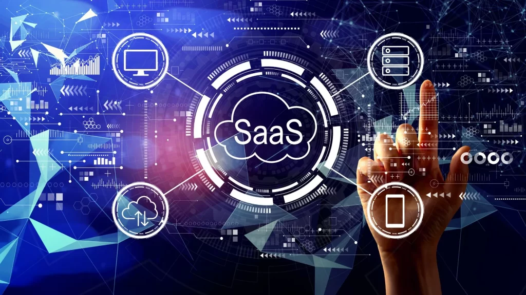 An index finger seems to be on the act of touching a screen. The word SAAS is superimposed on the photo, as well as some technological icons related to SaaS.