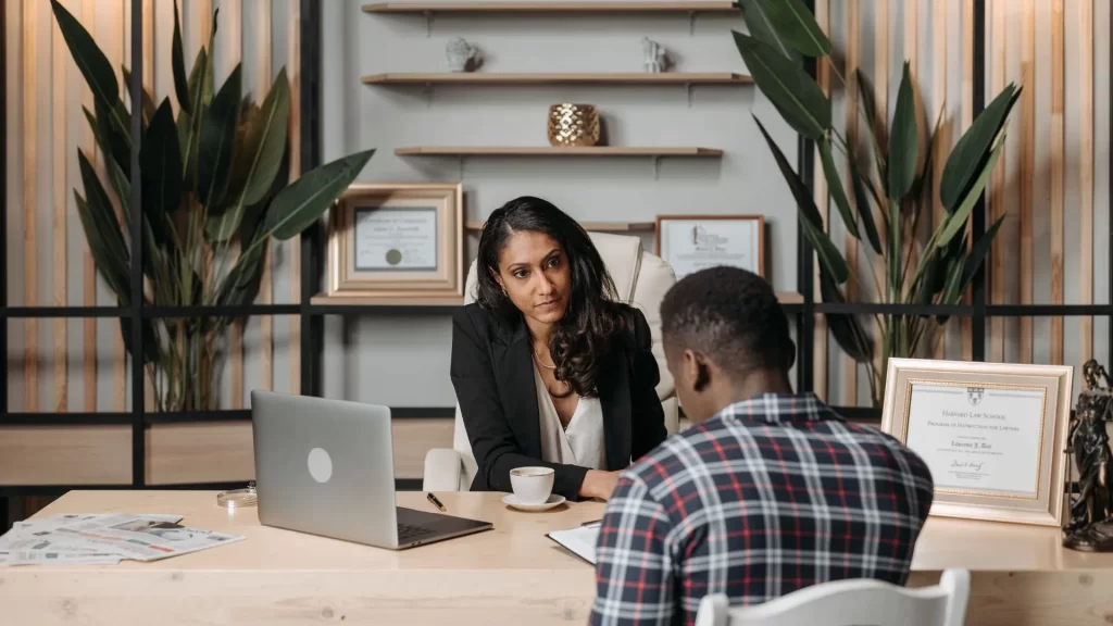 A female lawyer and a male marketing professional in earnest discussion for a marketing plan for personal injury law firms