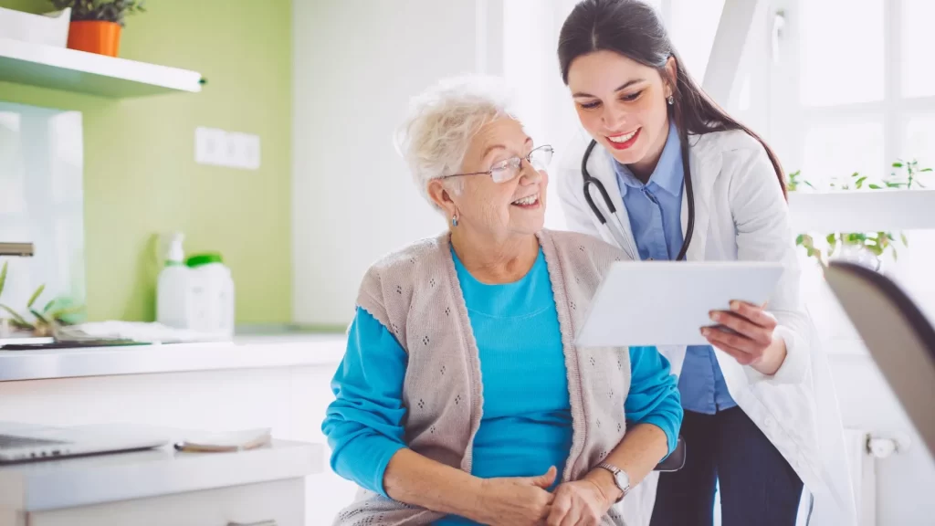 A healthcare professional using a tablet, presumably to check on their marketing efforts