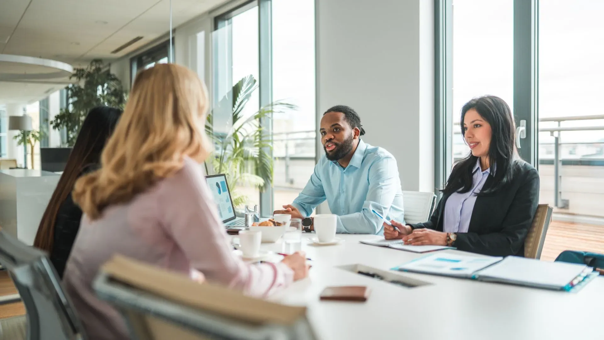 A team of digital marketing professionals meeting with lawyers