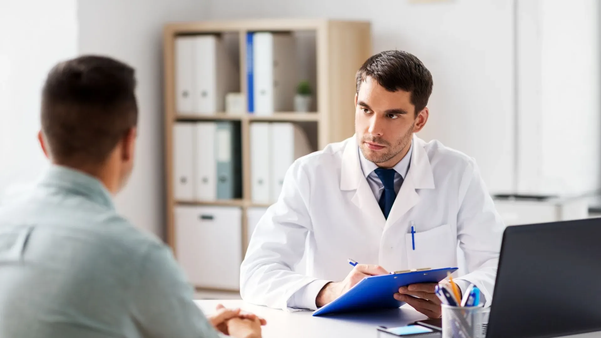 A doctor talking with a patient